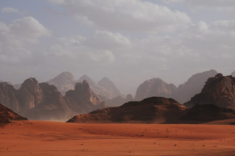 An empty desert road through the Western Desert dunes